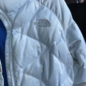 White feathered north face